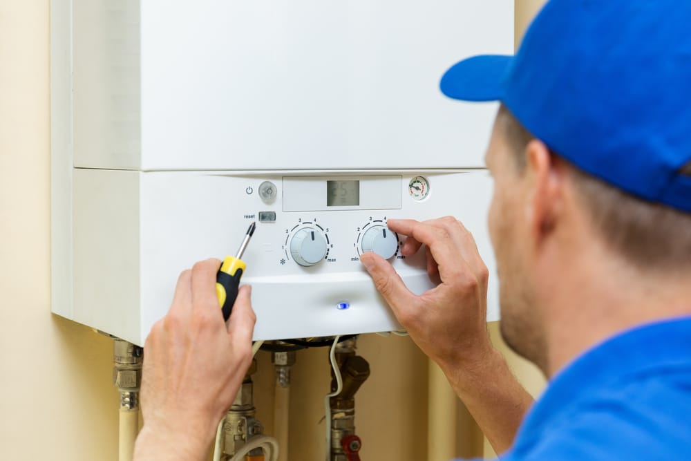 HVAC Technician fixing Heater